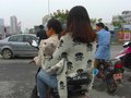Two women and a baby on an Electric Bicycle