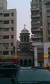 Old church wedged between Communist buildings