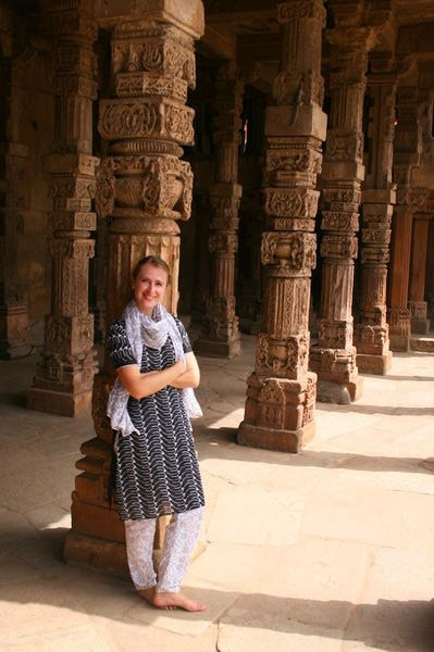 At Qutb Minar, against a pillar