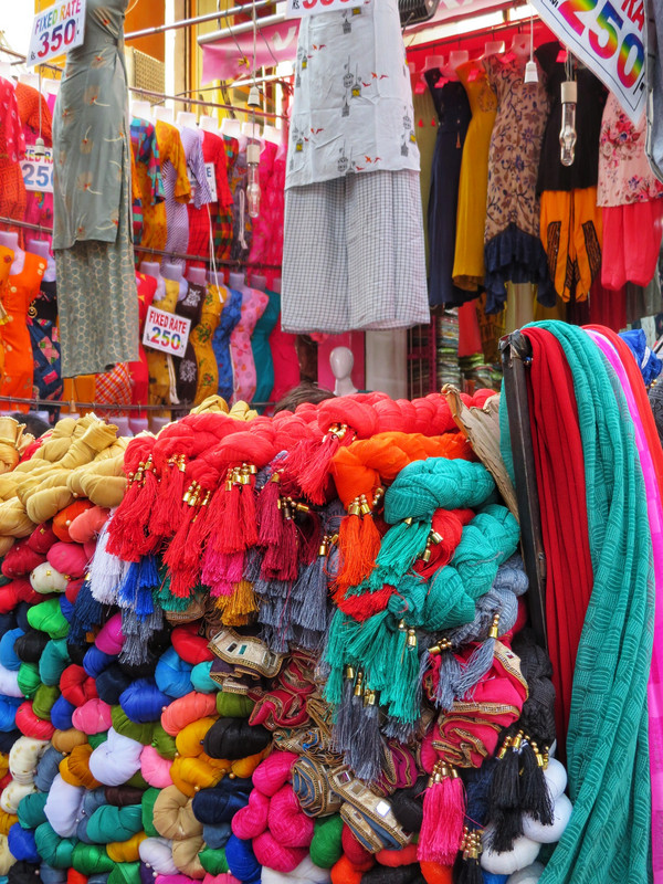 Bright scarves piled up in the market