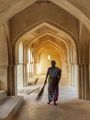 Lady sweeping inside Queen’s Barh