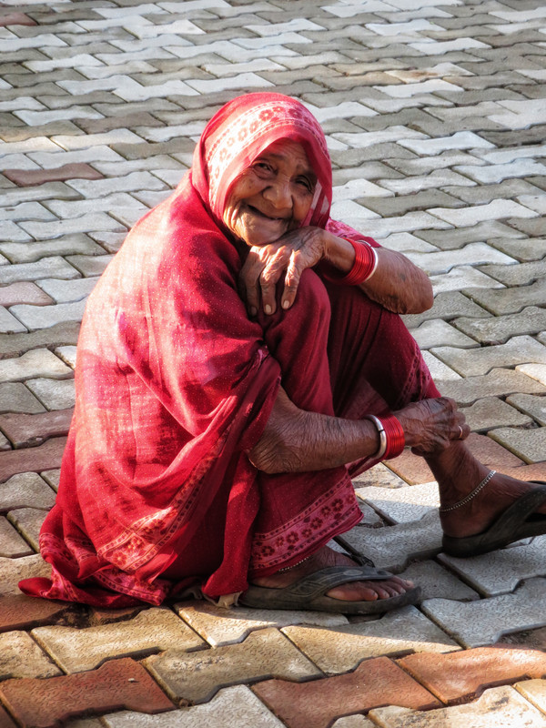 Old Woman sitting at the Jain Temples