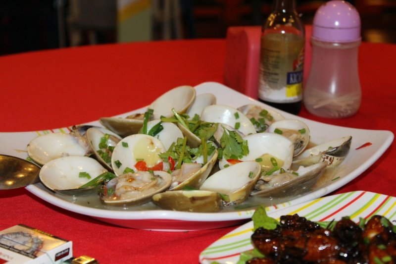 Giant white clams with ginger and spring onion