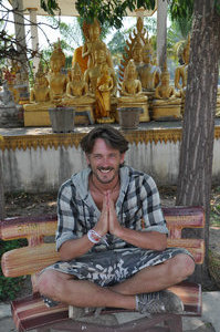 Davy sitting under the tree where Buddha was sitting during his visit