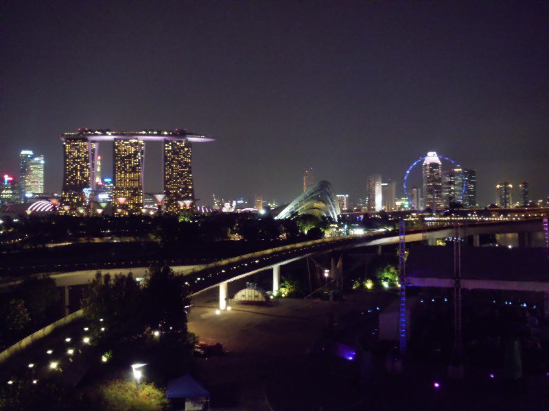 Singapore at night, note the Marina Bay Sands hotel to the left and Singapore Flyer to the right.