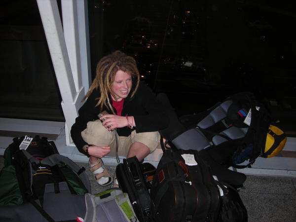 Elena resting in JFK with our gear II.