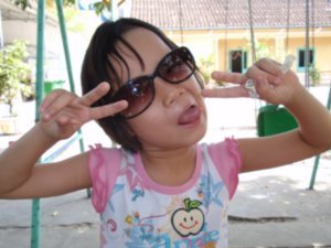 time at the orphanage: she loved our sunglasses..