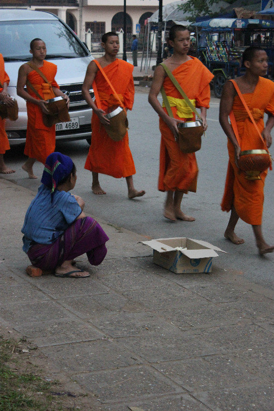 Monks Giving Charity
