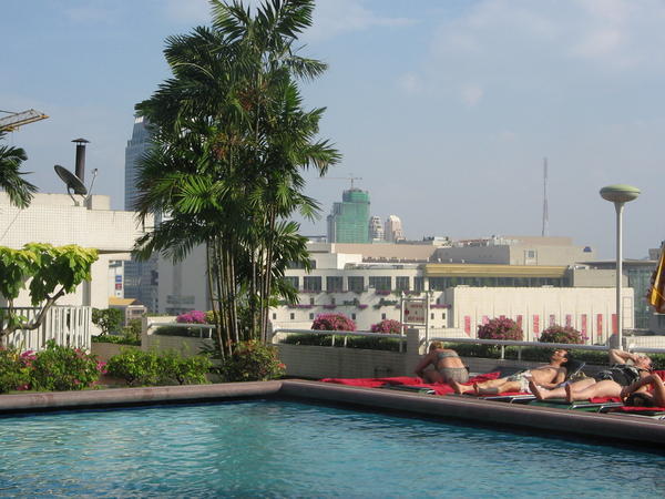Our one night of luxury - sunbathing on the rooftop pool with great view of Bangkok