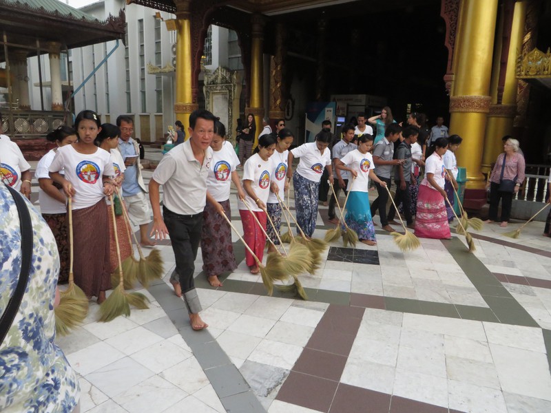 Sweeping the plaza at Shwedagon Pagoda