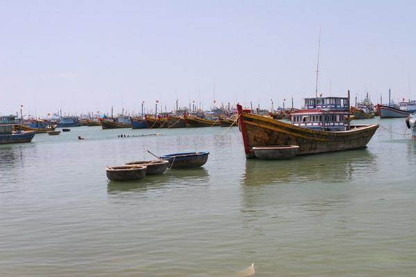Fishing boat, plus round dinghies