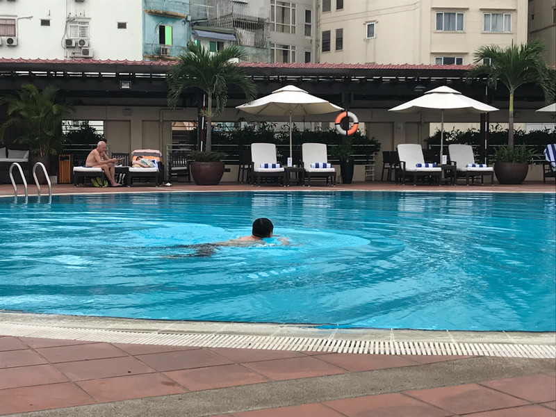 Chinese guy swimming in his jeans