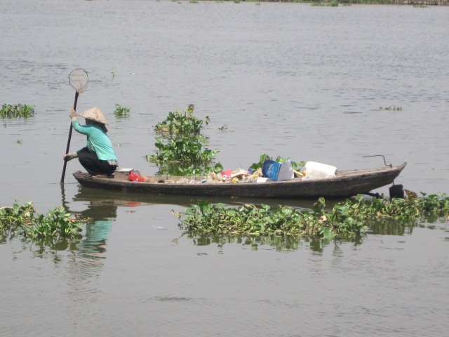 Sampan lady collecting recyclables