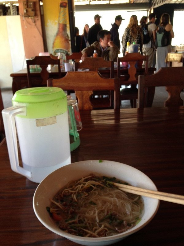 Our free lunch included in our bus ticket. Cold veg, rice and meat (Sam) or noodle soup (me).