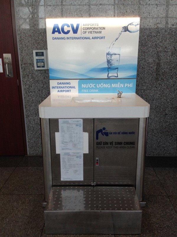 Water fountains. Take an empty plastic bottle through and fill up for the flight