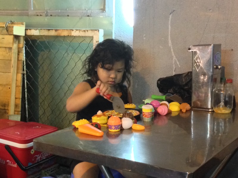 Little girl with toys, a rare sight