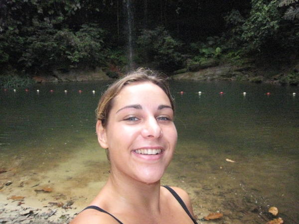 Me taking photos of myself in front of the waterfall we swam in