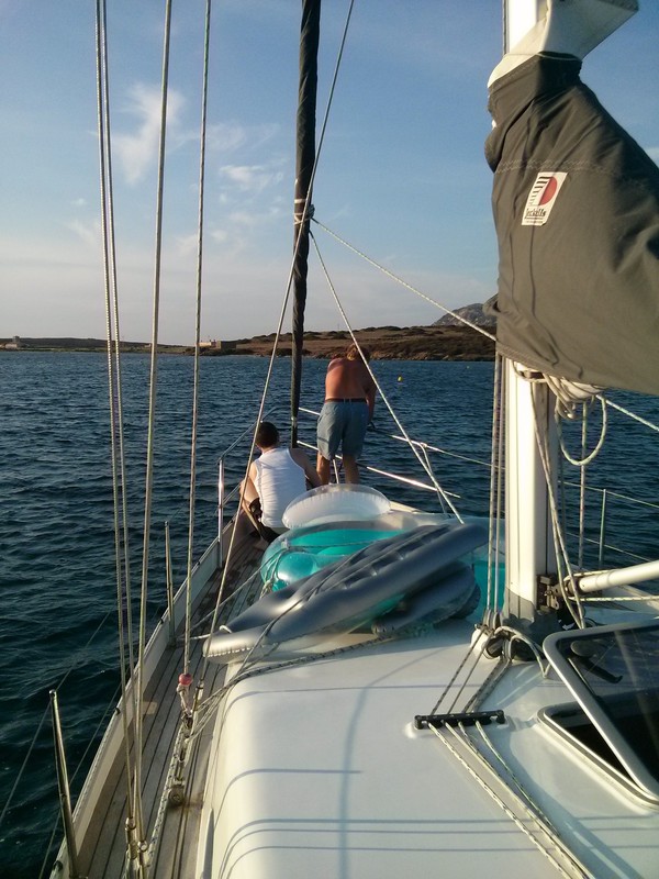 The boys trying to catch the mooring buoy in Asinara Island