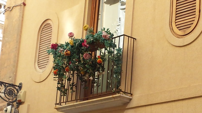 Flowery balconies in Trapani's old town