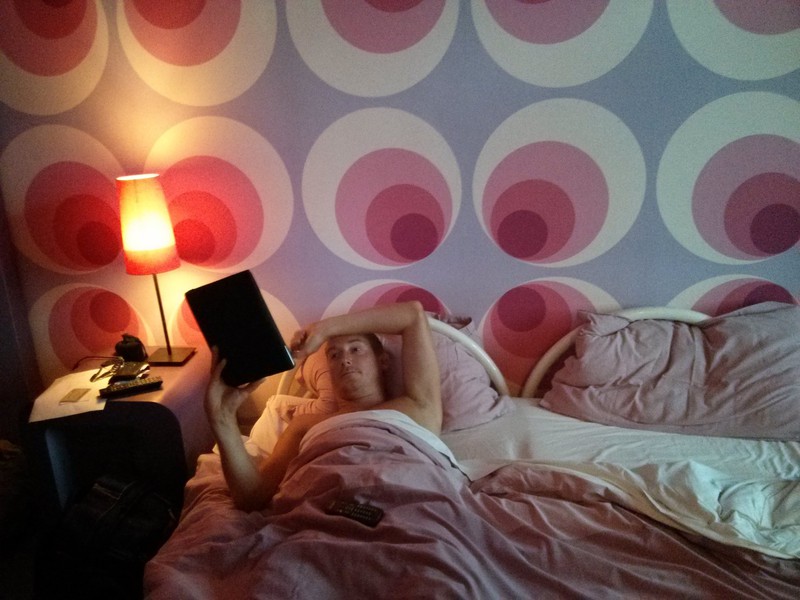 Mike in bed in our pink bedroom