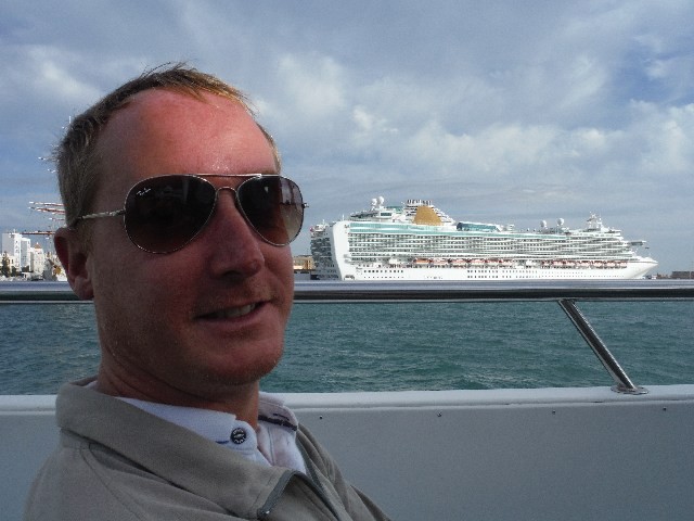 Mike on the ferry to Puerto Sherry with Ventura cruise ship in background