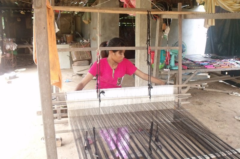 Weaving the cloth in one of the rural homes on Koh Dach