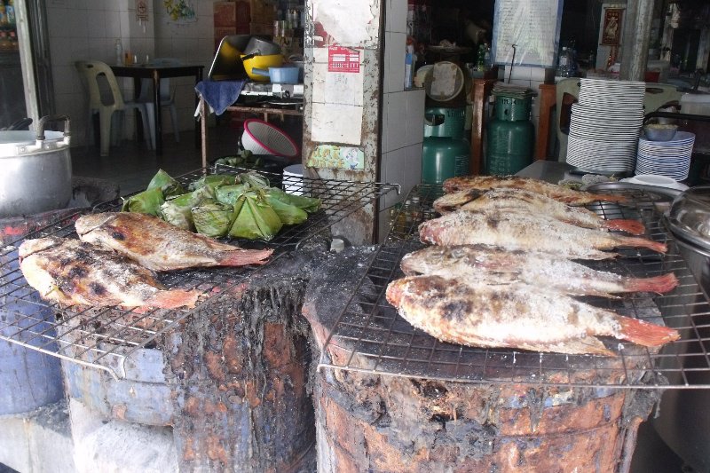 Fish being barbecued outside a restaurant