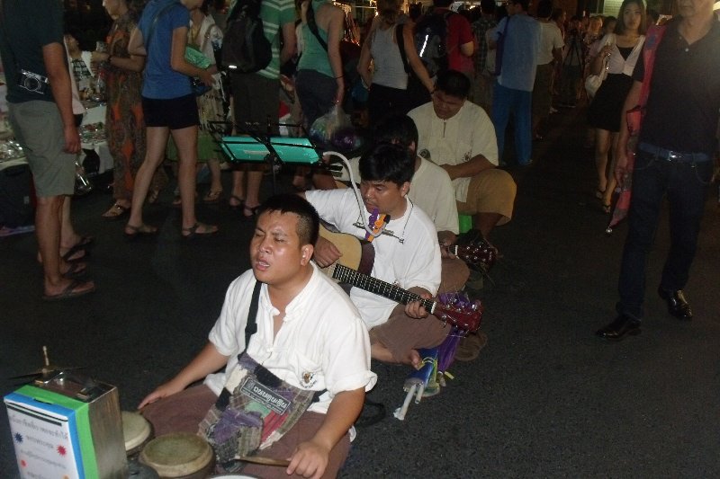 A group of musicians at the night market