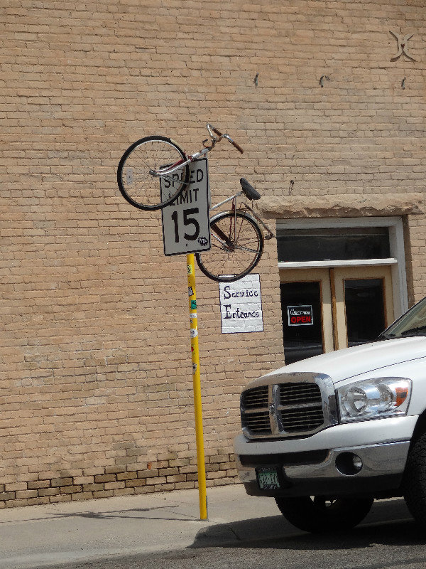 Bikes hanging from street signs