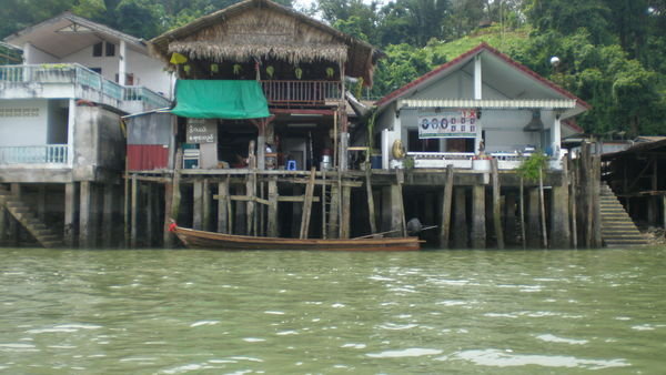 homes along the water..shops also occupy these water accessible structures