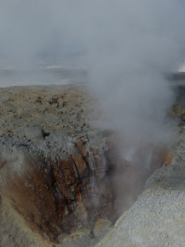 Inside a large steaming geyser