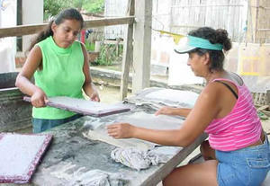women recycling paper