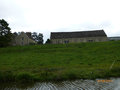 Large tithe barn and church ay Upper Heyford.