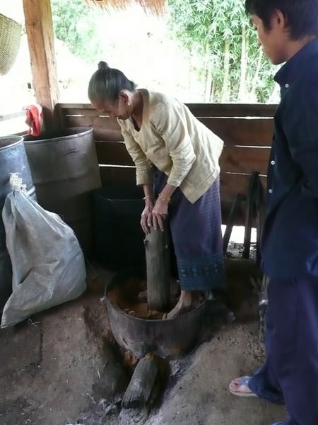 Local woman stomping around making Lao-Lao