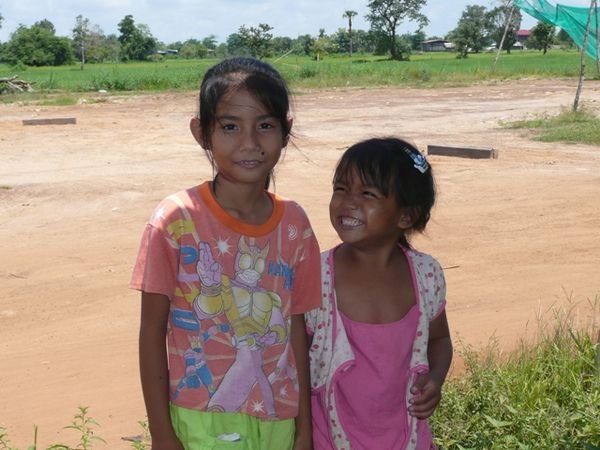 Two sweet girls who took a liking to us while we waited for our bus, Ban Nakasang.