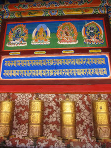 Prayer wheels are devices inscribed with mani prayers and containing sutra scrolls attached to their axels. Each turn of a prayer wheel represents a recitation of the prayer inside and transports it to heaven. Varying in size from thimbles to oil drums, w
