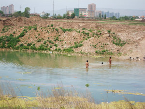 kids swimming in a river outside Linxia