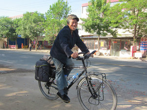 this elder man fixes bikes