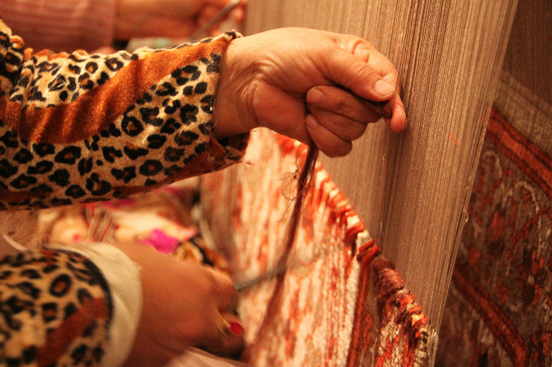 in Khiva making silk carpets