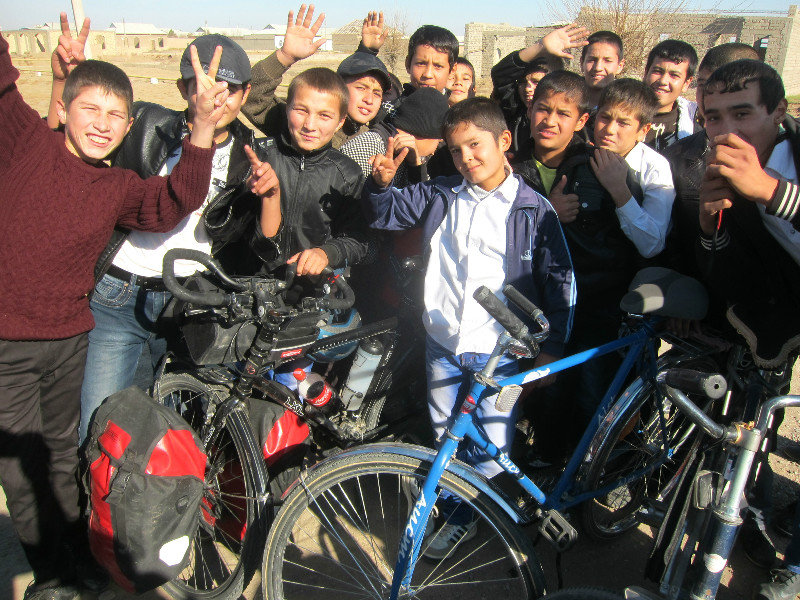 a group of Uzbek students around my bike