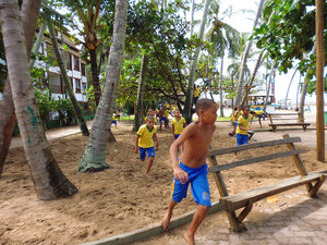 school kids playing football at recess