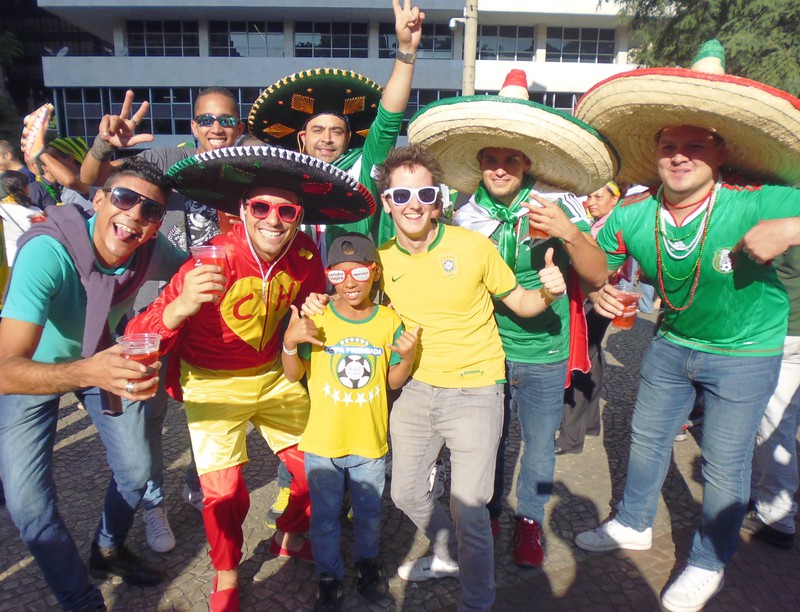 Mexican fans surround Brazilian kids. 