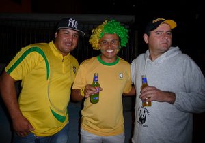 Edi (middle) and the neighbors, celebrating Brazil's victory over Croatia. 