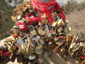 Many couples have locked their love at the top of the mountain