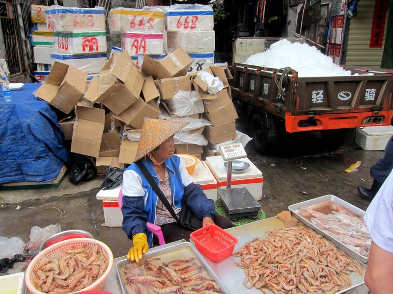 by the docks, selling shrimp