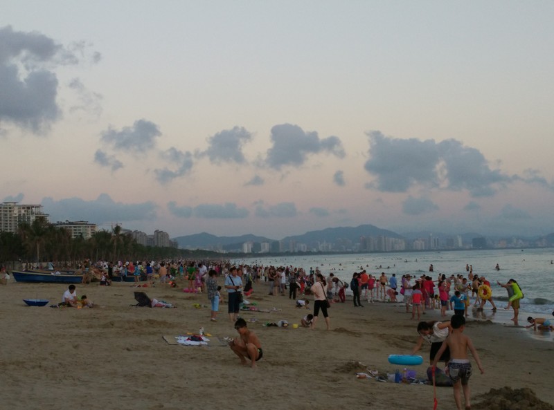 crowded beach in the evening