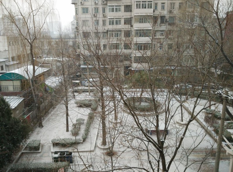 We're back in Beijing and it's snowing!