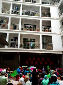 Elderly people put on a performance downstairs their homes for Spring Festival