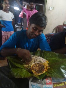 rice, vegetables and eggs wrapped in a banana leaf