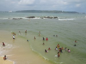 locals swimming at the beach in the old quarter